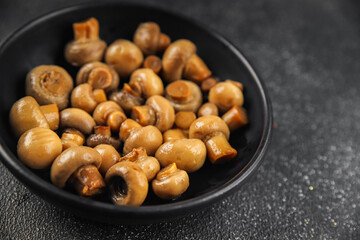 Champignon mushroom canned product tasty food dish fresh delicious gourmet food background on the table rustic food top view copy space top view keto and paleo diet Vegetarian and vegan food