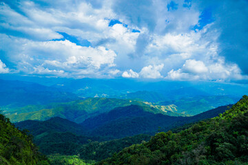 Breathtaking mountain view lush forest landscape scenic photography daytime wide angle natural beauty and adventure