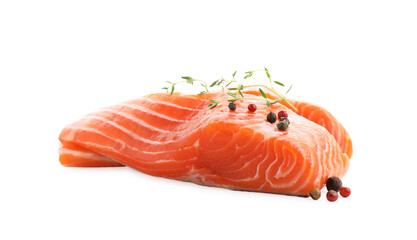 Pieces of fresh salmon, peppercorns and thyme isolated on white