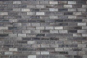 beautiful stylish brick wall in black, white and gray tones with divisions