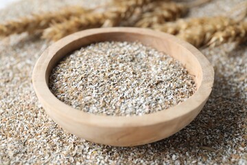 Bowl with fresh rye bran, closeup view