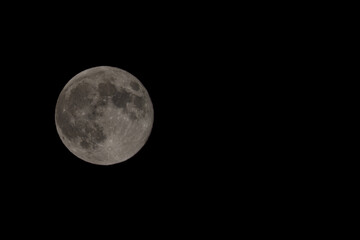 Full moon on night black sky, moon isolated on night sky