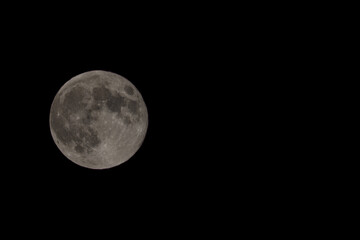 Full moon on night black sky, moon isolated on night sky