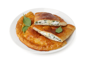 Tasty calzones with cheese and basil isolated on white