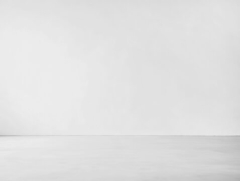 photo of an empty white wall and floor for a product presentation