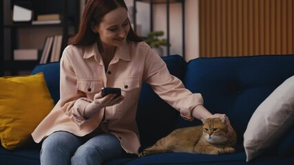 Smiling woman buying pet supplies for her cat, mobile shopping, discounts