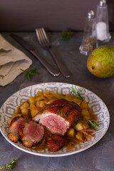 Duck breast fillets with pears and rosemary