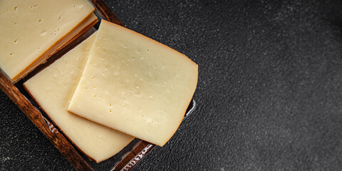 Raclette cheese tasty food dish fresh delicious gourmet food background on the table rustic food top view copy space top view