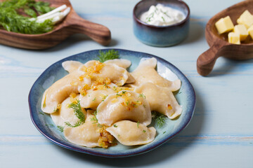 Dumplings filled with mashed potatoes. Varenyky, vareniki, pierogi, pyrohy - dumplings with filling