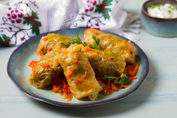 Stuffed cabbage leaves. Cabbage wraps. Chou farci, dolma, sarma, golubtsy or golabki. Flat lay, layout, overhead