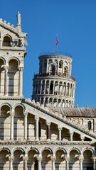 Fototapeta premium The famous architecture in Pisa city. Piazza del Duomo, Battistero di San Giovanni, Leaning Tower, Cattedrale di Pisa
