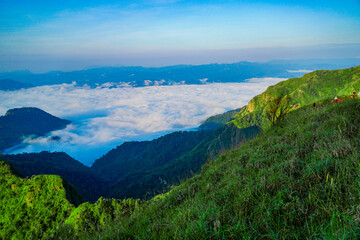 Naklejka premium Exploring the serene mountain landscape nature vista cloud cover lush greenery aerial view tranquility and adventure