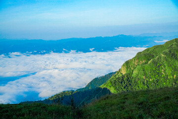 Breathtaking sunrise over cloudy mountain range nature landscape scenic view serene environment tranquil concept for reflection