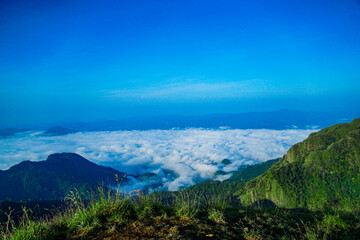 Breathtaking sunrise over cloudy mountain peaks nature scene scenic view serene landscape travel inspiration