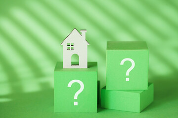 Sustainability  ESG Concept. Question mark sign, Green House on Green background. ESG. Eco House
