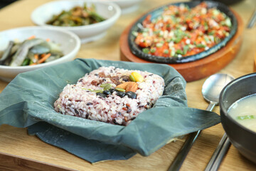 rice and nuts wrapped in lotus leaves