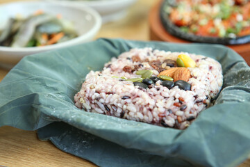 rice and nuts wrapped in lotus leaves
