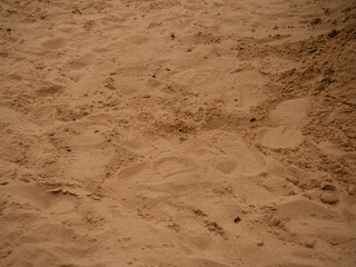 Footprints on sand walkway
