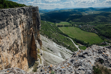 Beautiful scenery from the top of the cliff to the mountain forest