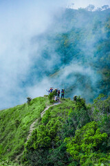 Obraz premium Adventurous trekking expedition mountain ridge outdoor adventure misty environment group perspective nature exploration