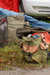 Lohja, Finland - September 28, 2024..Collection of fishing gear and equipment including backpacks, rods and nets on grass land. A break in the pier fishing competition in Lohja.