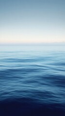 Obraz premium Serene Ocean View Distant Mountains Under Calm Sky