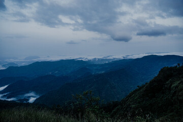 Breathtaking mountain view high altitude scenic landscape foggy atmosphere panoramic perspective nature's serenity