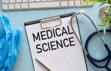 Medical Science text on card on the notebook page on the table, medical concept