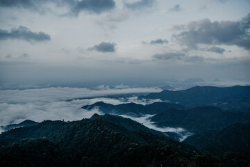Majestic mountain range overlooking clouds scenic landscape nature photography peaceful environment aerial view serenity in nature