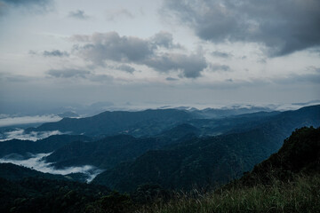 Naklejka premium Breathtaking mountain view at dawn serene landscape nature photography cloudy atmosphere wide angle tranquility and adventure