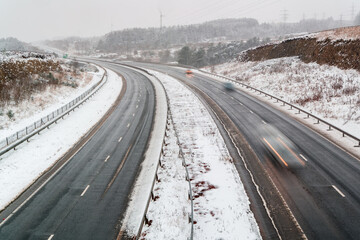 Long exposure motion blur of traffic on the A465 at Ebbw Vale during a winter snow storm