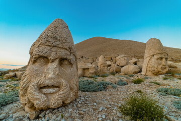 Fototapeta premium Nemrut Mountain in Adiyaman. Close-up of the giant stone head sculptures at the top of the Nemrut mountain. Adiyaman, Turkey.