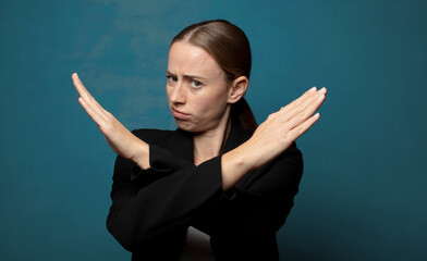 looking annoyed and sick of your attitude, saying enough! hands crossed up front, telling you to...