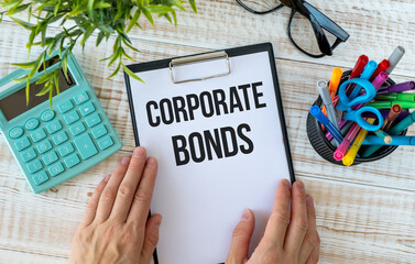 CORPORATE BONDS text on clipboard on wooden background