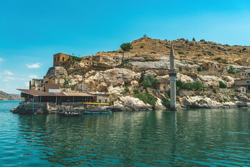 Halfeti Sunken Minaret. The view of the minaret that remained from the city that sank as a result of rising water. Touristic tours are organized.