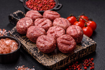 Raw meatballs of minced meat beef, pork or chicken with salt, spices