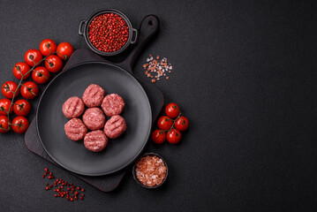 Raw meatballs of minced meat beef, pork or chicken with salt, spices