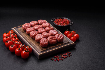 Raw meatballs of minced meat beef, pork or chicken with salt, spices