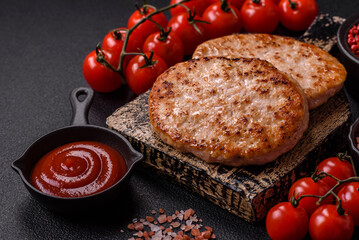 Grilled chicken burger cutlet with salt, spices and herbs
