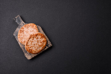 Grilled chicken burger cutlet with salt, spices and herbs
