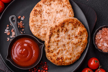 Grilled chicken burger cutlet with salt, spices and herbs