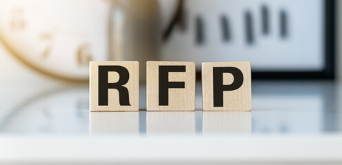 text RFP on wooden cubes over blur background with copy space, request for proposal concept