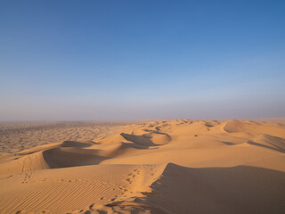 The Rub al Khali, or "Empty Quarter," is a vast desert expanse that stretches across Oman, known for its towering sand dunes and serene, untouched beauty. 