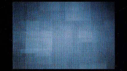 close-up of the screen texture of an old VHS video tape, with a blue color dot background and a...