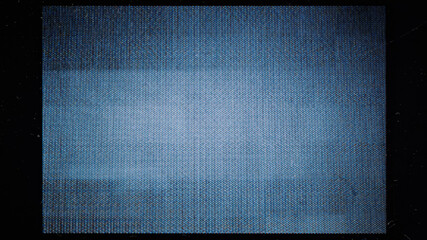 close-up of the screen texture of an old VHS video tape, with a blue color dot background and a...