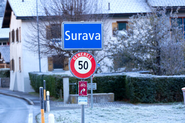 Mountain village of Surava with traffic signs and sign energy town on a sunny autumn day. Photo taken November 15th, 2024, Surava Albula, Switzerland.