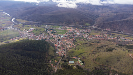 Cistierna, spain, surrounded by mountains and forests, seen from above