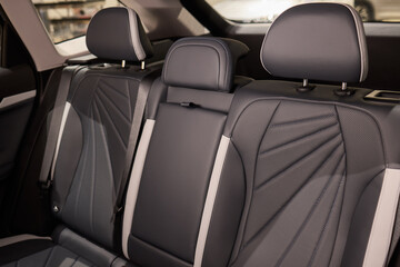 Obraz premium Car back seat with headrest and arm rest, a comfortable automotive fixture
