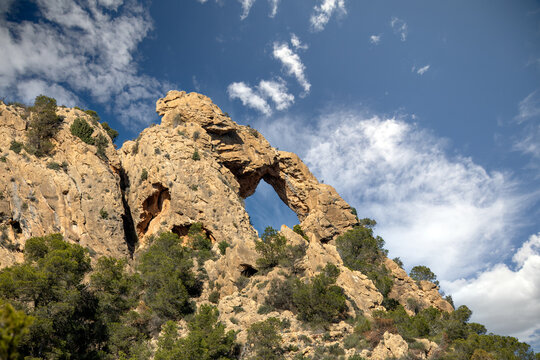 Arch-shaped rock formation in the Ricote Valley, Region of Murcia, Spain