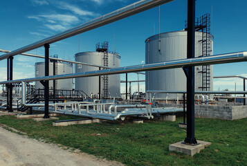 Storage tanks and pipes in oil industry facility